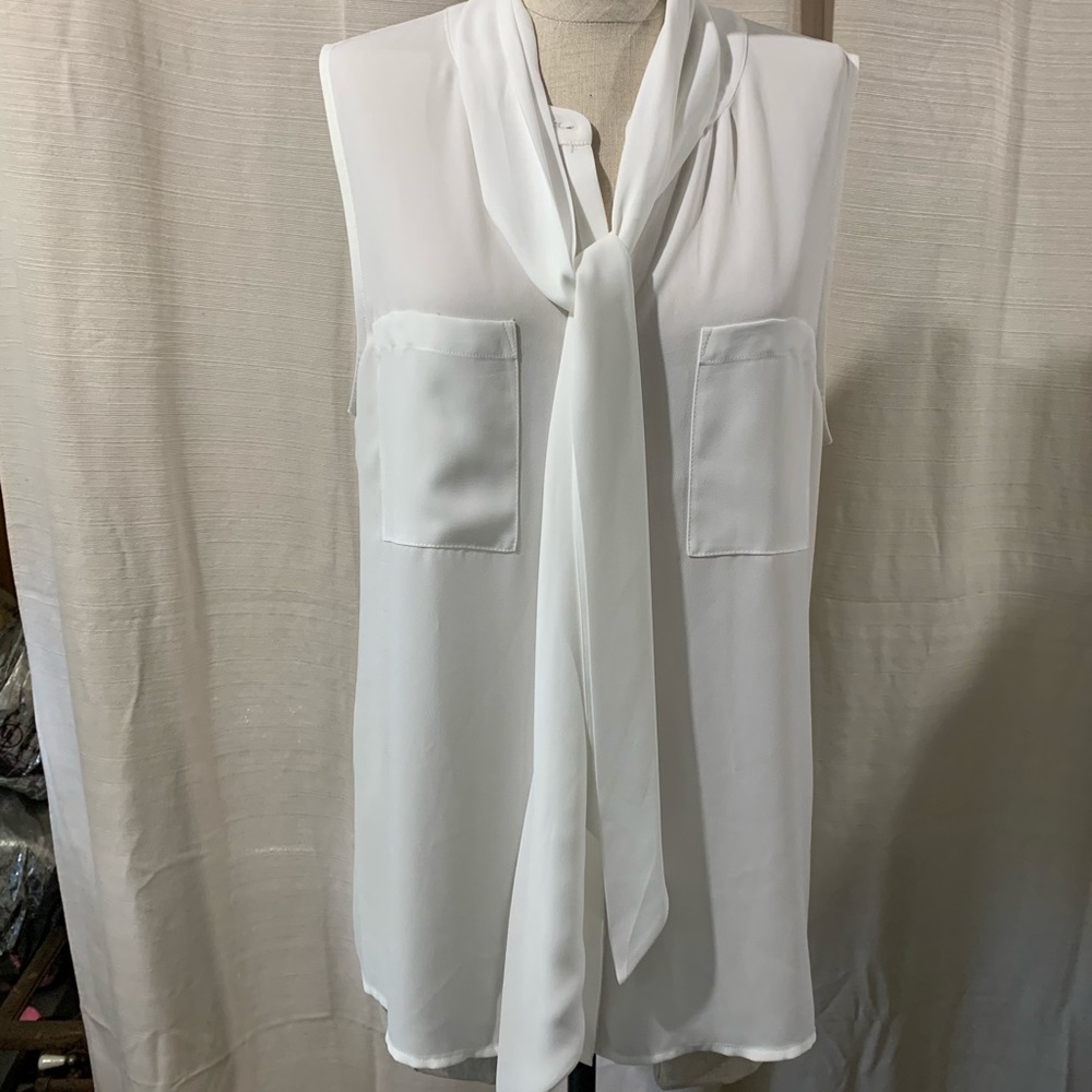 Sleeveless white blouse